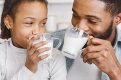 Image Father and daughter drinking milk