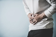 Image man holds belly in pain