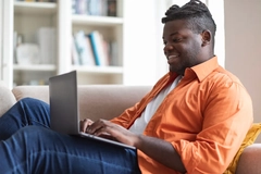 Image Man on his computer