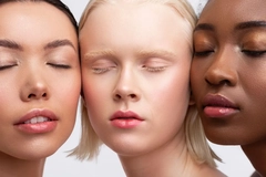 Women with diverse skin tones and eyes closed