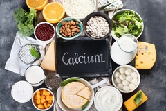 Image Calcium-rich foods assortment, like cheese, milk, means, leafy greens