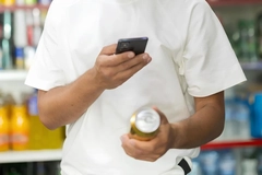 Image A person scan a beer can