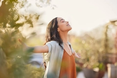 Image Happy woman at sunset
