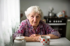 Older woman drinking coffee