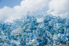 A stack of water bottles in a landfill.