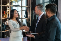 Image man in suit shakes hands with women, business deal