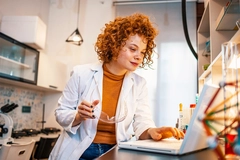 Image Food scientist working on laptop.