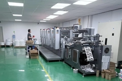 Image A flexographic press producing printed packaging labels at SZKAYU Packaging's manufacturing facility in China.
