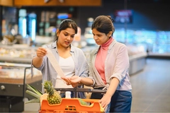 Consumers in Asia checking product prices.
