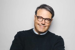 Image headshot of man in black sweater and greying hair