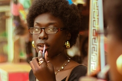 Image woman applying lipstick in shop