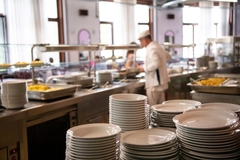 Image cafeteria chef with porcelain plates
