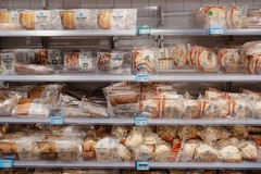 Image Baked goods on the shelf of a grocery store.