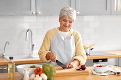 Image elderly woman cooking healthy meal