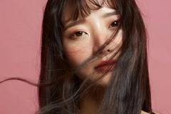 Image Korean woman with hair blowing in her face