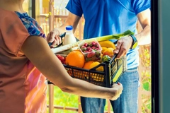 Image woman getting healthy groceries delivered