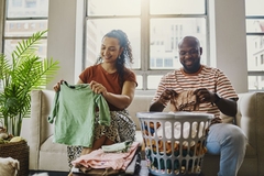 people folding laundry 