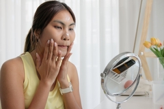 Image Indonesian woman applying face cream.