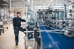 Image working producing plastic bottles in factory