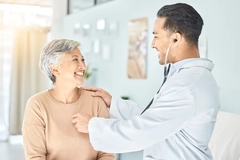 Doctor checking patient heart rate