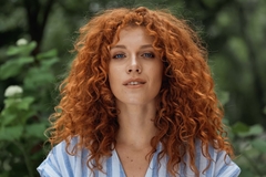 woman with red curly hair