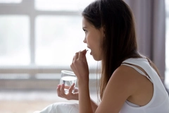 Image teen taking supplement