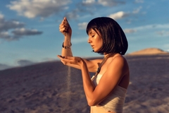 Image Woman in Egypt holding sand.