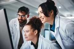 Image Researchers behind a computer