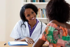 Woman getting medical advice from doctor Woman getting medical advice from doctor