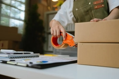 E-commerce seller packs order