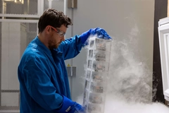 male scientist with cultivated meat cell bank out of freezer