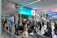Image Crowd walking in corridor between tradeshow halls