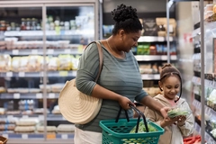 Woman and child shopping in supermarket