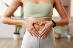 Image Woman holding her stomach