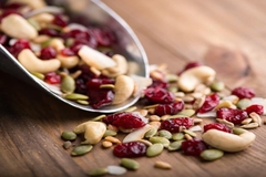 Bowl overtipping with legumes and nuts