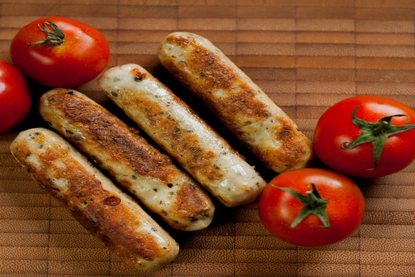 Image Grilled sausages with fresh tomatoes.