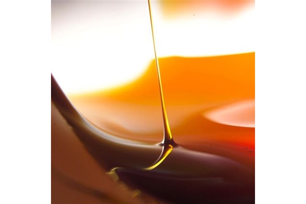 Image Liquid dripping from a glass in a close-up shot.