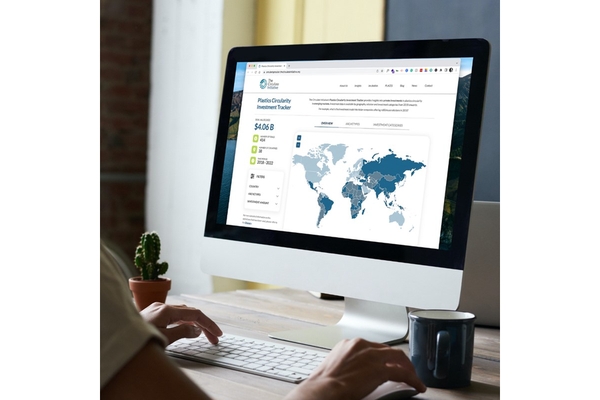 Woman looking at laptop with stocks on them.