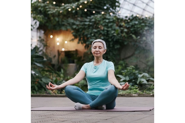 Image Older woman doing a relaxation exercise.