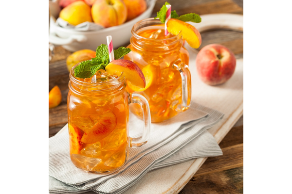 Image Two glass mugs of juice on a table