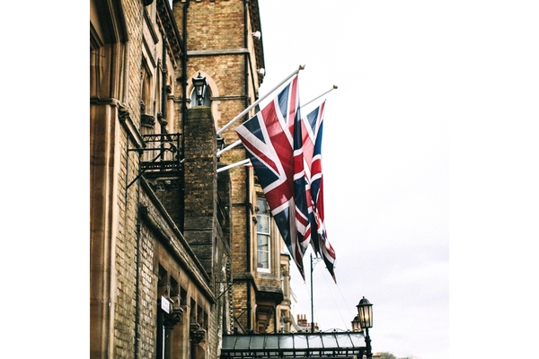 Image UK flags hanging from a building