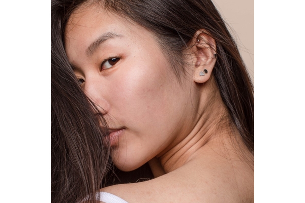 Asian woman looking back over her shoulder