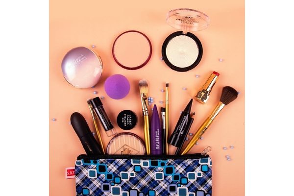Image makeup products coming out of a pouch.