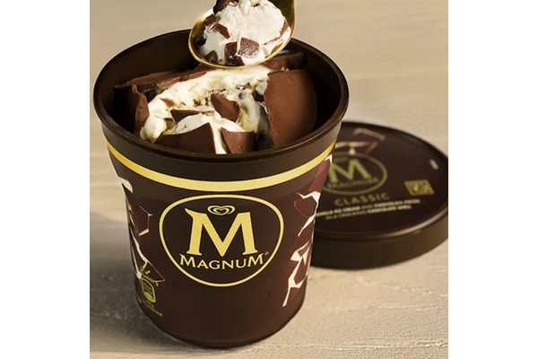 Image A cup of ice cream is placed on a table.