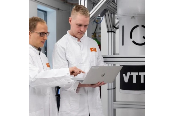 Image Researchers in lab looking at laptop.