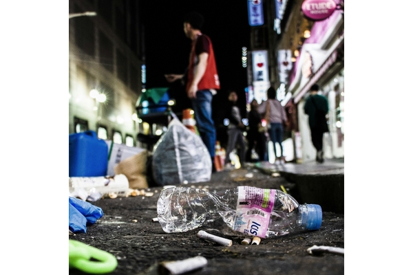 plastic pollution caused by littered plastic water bottle and other packaging