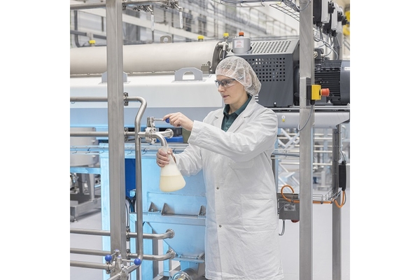 Image A person is developing for the production of plant-based food, including meat substitutes, plant-based drinks and ingredients.