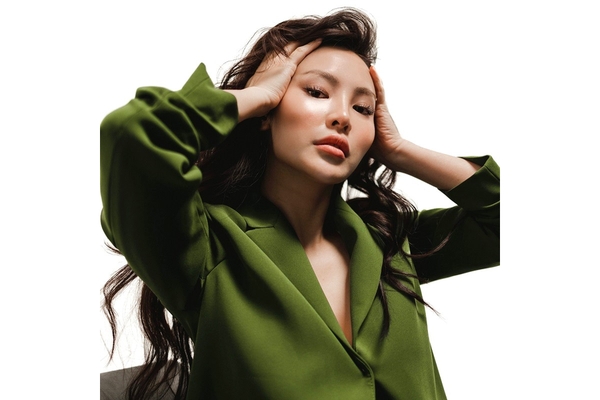 Image A woman with smooth skin poses.