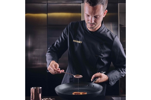 A chef is dressed in black.