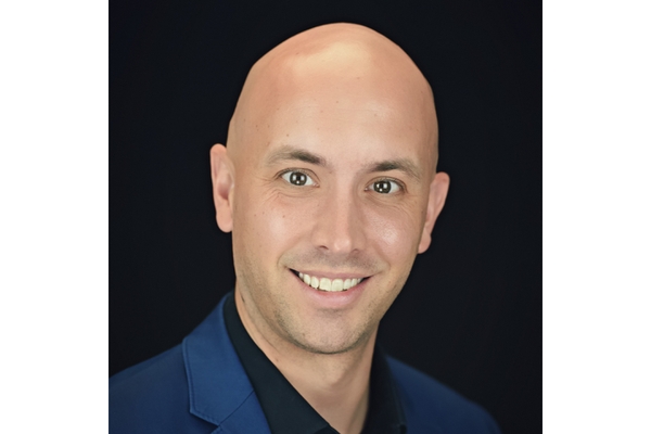 A man smiling at the camera.